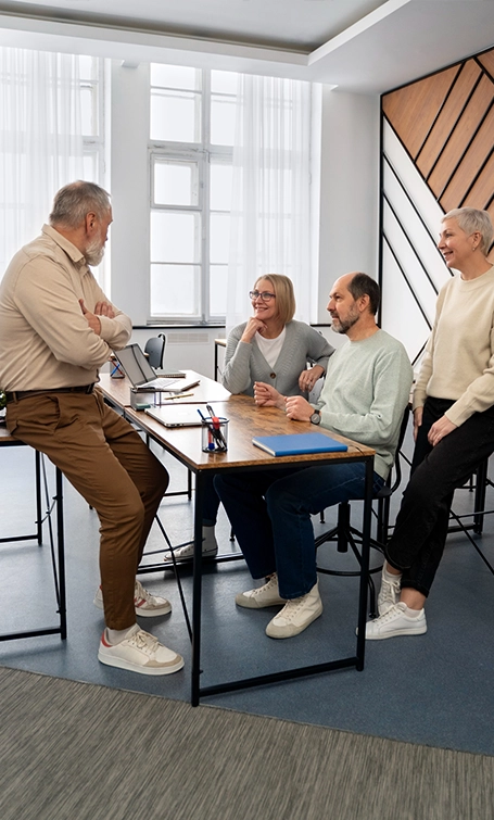 A group of IT professionals in a small IT company meeting